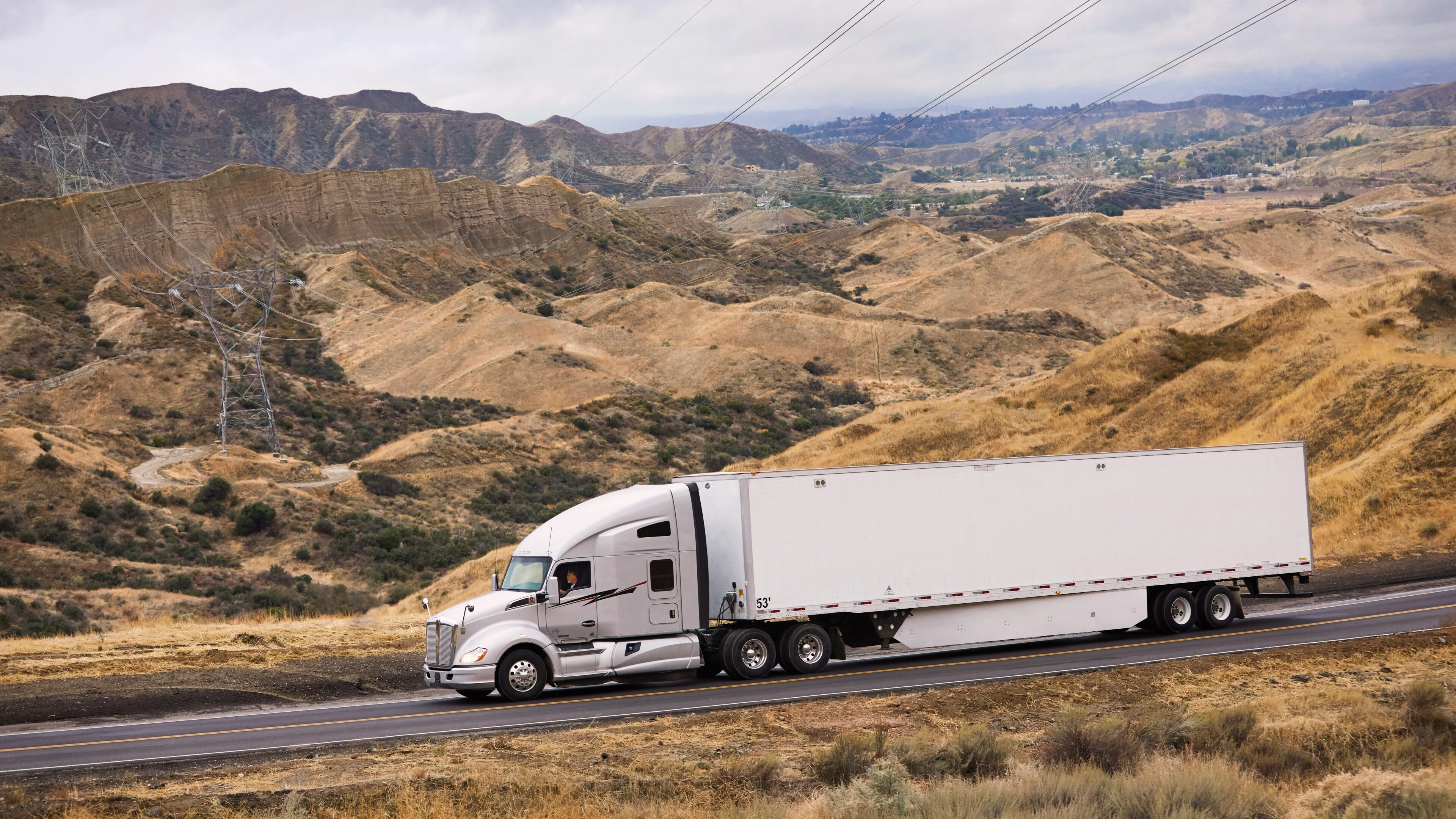 Truck driving on road.