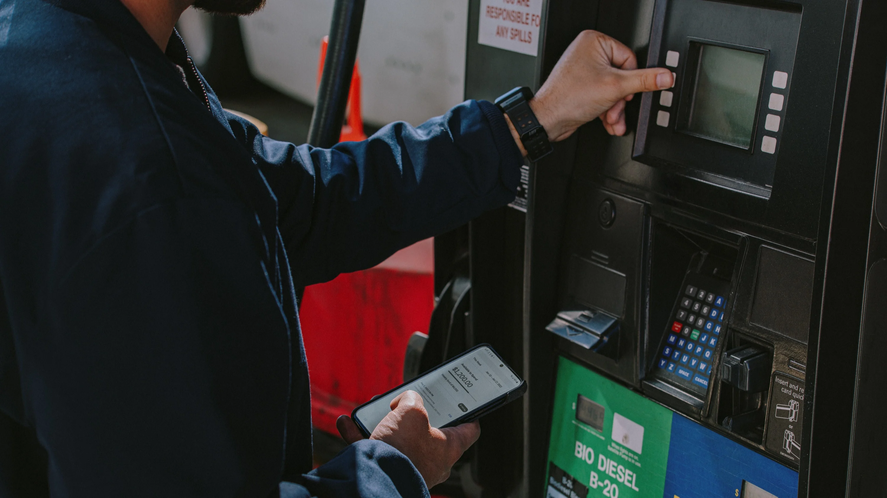 Man paying for gas at a pump