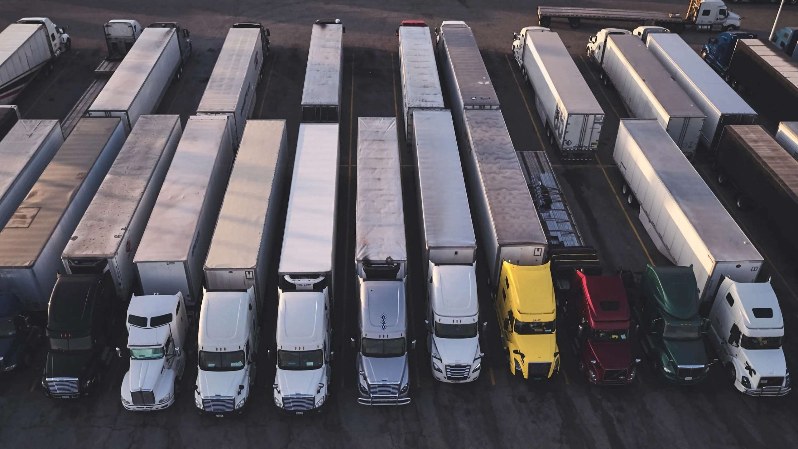 Overhead view of trucks in rows.